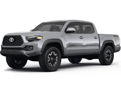 A picture of a silver Toyota Tacoma TRD off road 4x4 pickup truck, taken from the front driver's side corner angle.