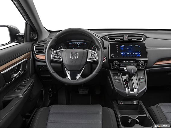 A driver's view of a honda crv steering wheel and front console