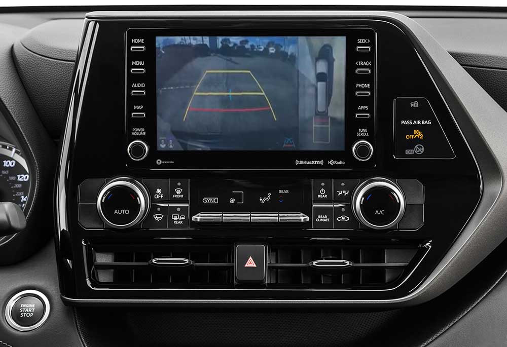 A close up of a Toyota Highlander's media screen which is displaying the backup camera and 360 view features.