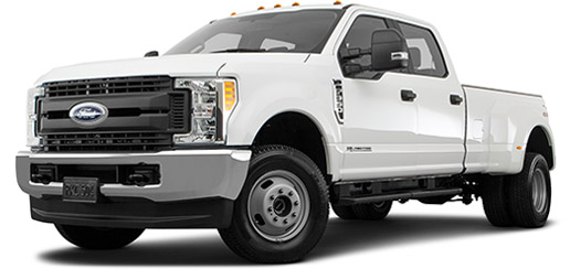 A picture of a 2019 Ford F 350 Lariat 4WD dually with white exterior paint from the front drivers side angle